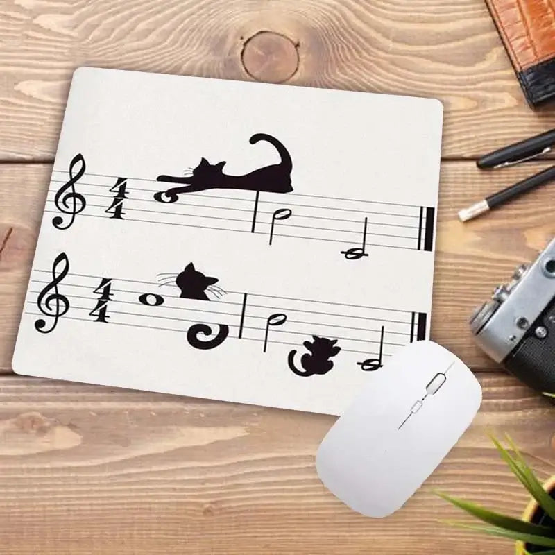 Cute Cat Mousepad with playful black cat silhouettes on musical notes. Fun and artistic design for cat and music lovers.
