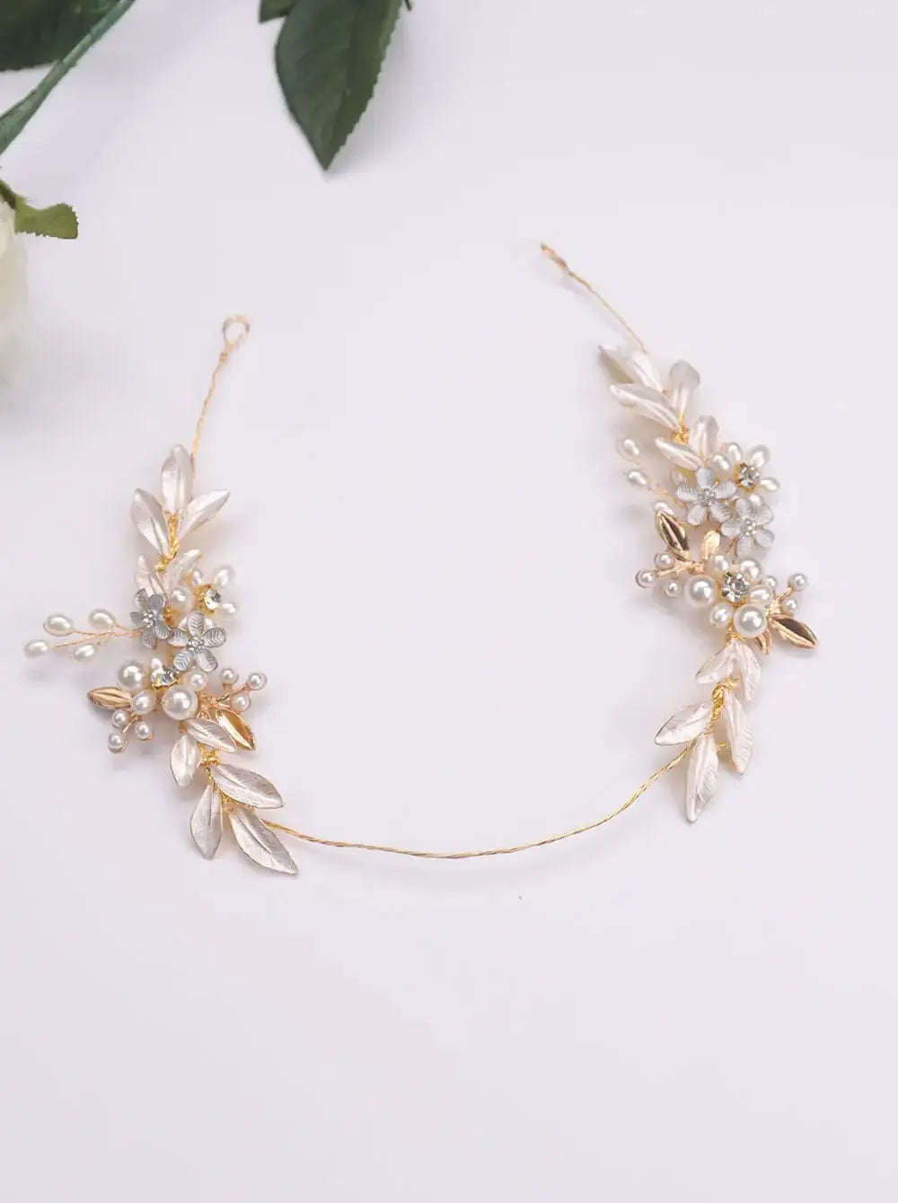Princess Leaves Hair Accessories laid flat, showing gold wire base with pearl and leaf motifs, perfect for bridal hairstyles.