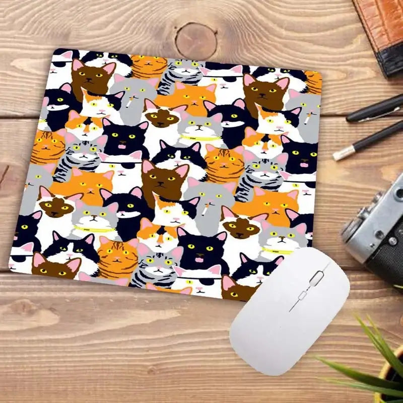 Cute Cat Mousepad with colorful cartoon cat faces pattern. Vibrant and fun design perfect for cat enthusiasts' desks.
