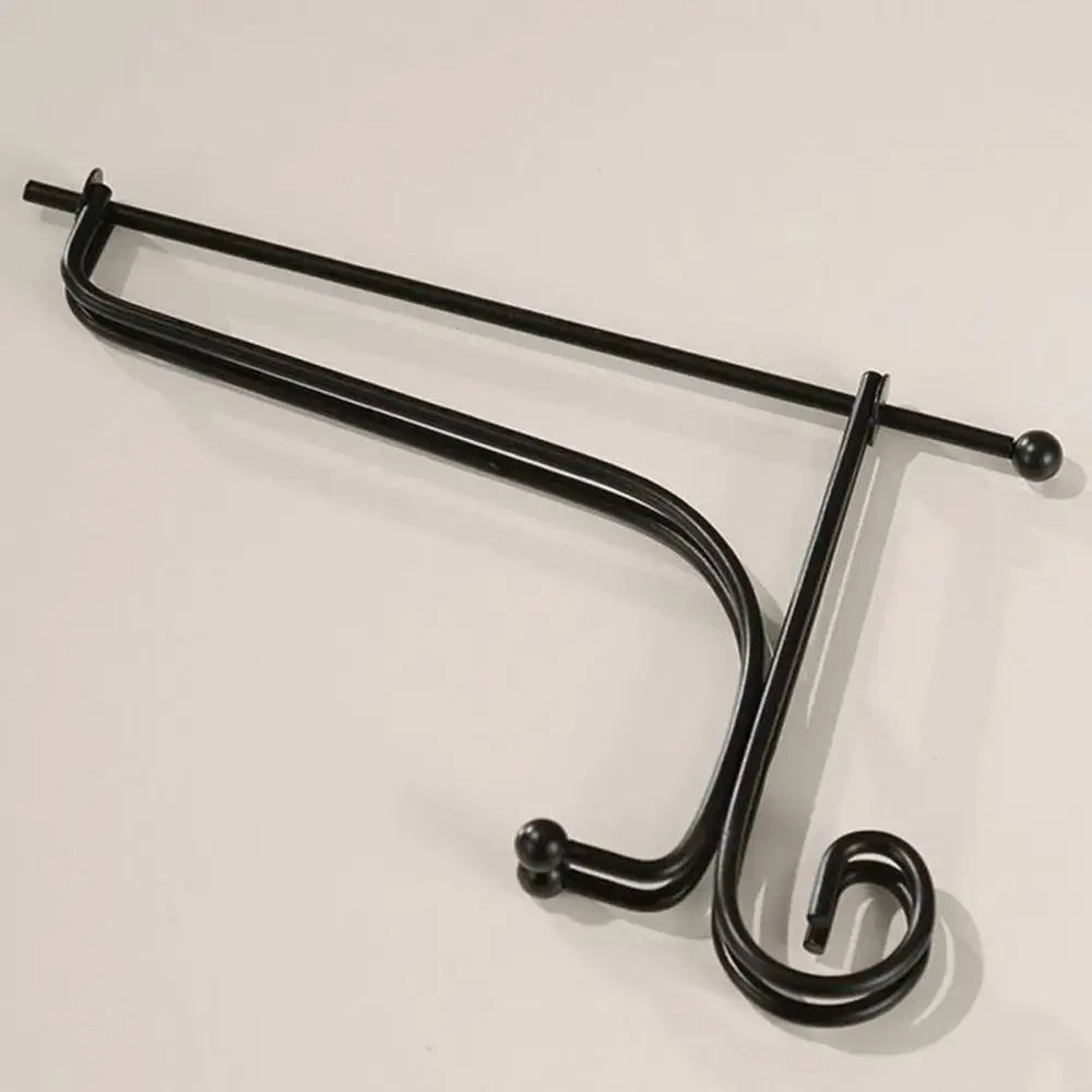 Folded black iron plate rack easel showing compact design and sturdy construction. Perfect for easy storage and portability.