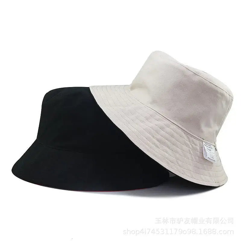Oversize cotton bucket hats in beige and black offer chic sun protection. Unisex wide-brim design ideal for summer fashion and outdoor wear.