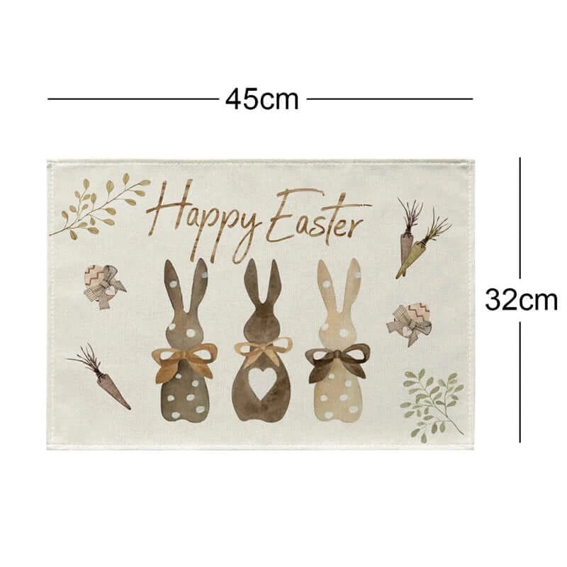Easter Bunny placemat measuring 45x32cm with bunny silhouettes and 'Happy Easter' text. Complements spring table settings.