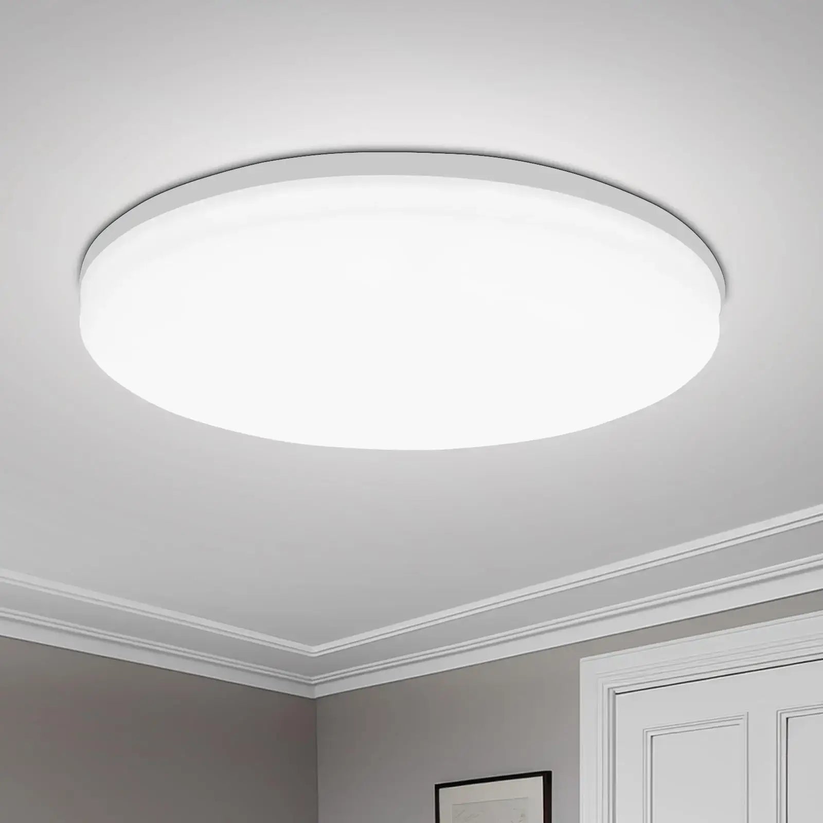 Round LED Ceiling Light with ultra-thin minimalist design mounted in a modern room. Ideal for bright, space-saving ceiling lighting.