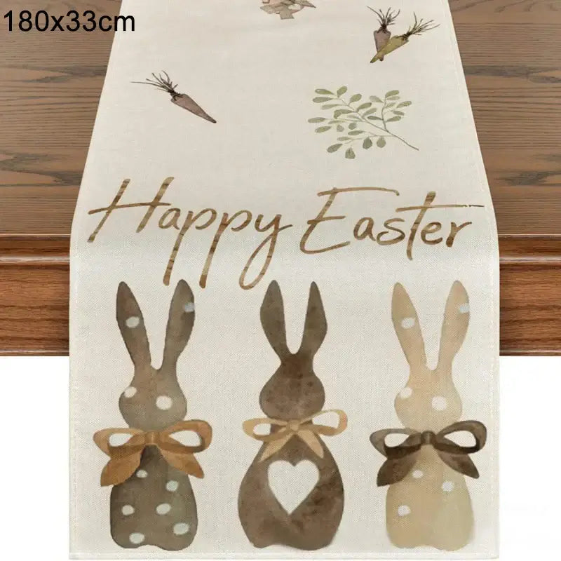Happy Easter Bunny Table Runner in linen with brown bunny silhouettes and carrot accents. Measures 180x33cm for festive table styling.