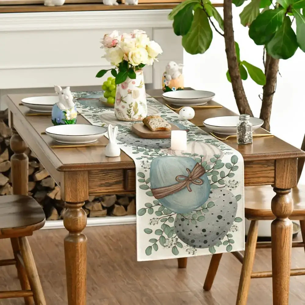 Eucalyptus Easter Table Runner - Linen styled on a wooden table with spring decor and dinnerware. Perfect for Easter brunch settings.