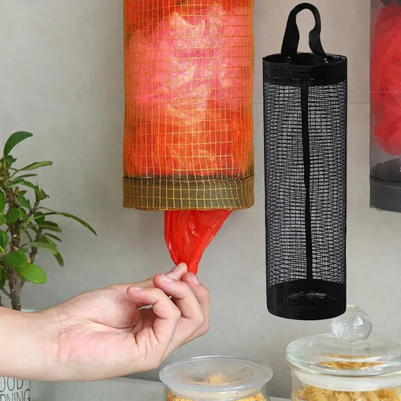 Black mesh kitchen plastic bag holder with elastic bottom for easy dispensing. Perfect for compact and accessible bag storage.