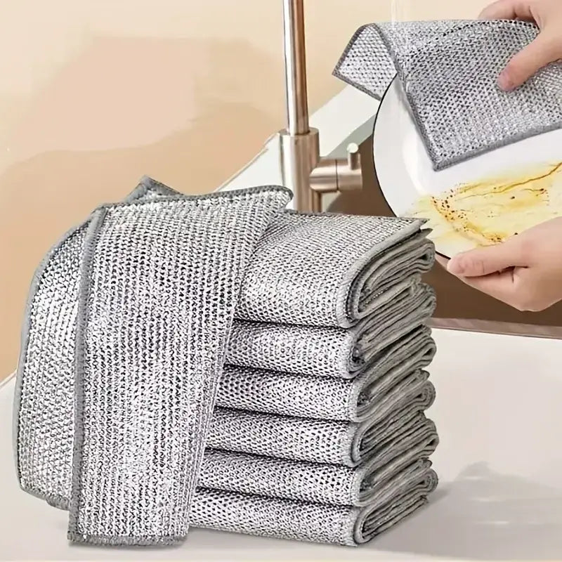 Magic Dishcloth Silver Wire cleaning plate in kitchen sink, highlighting reusable and eco-friendly cleaning performance.