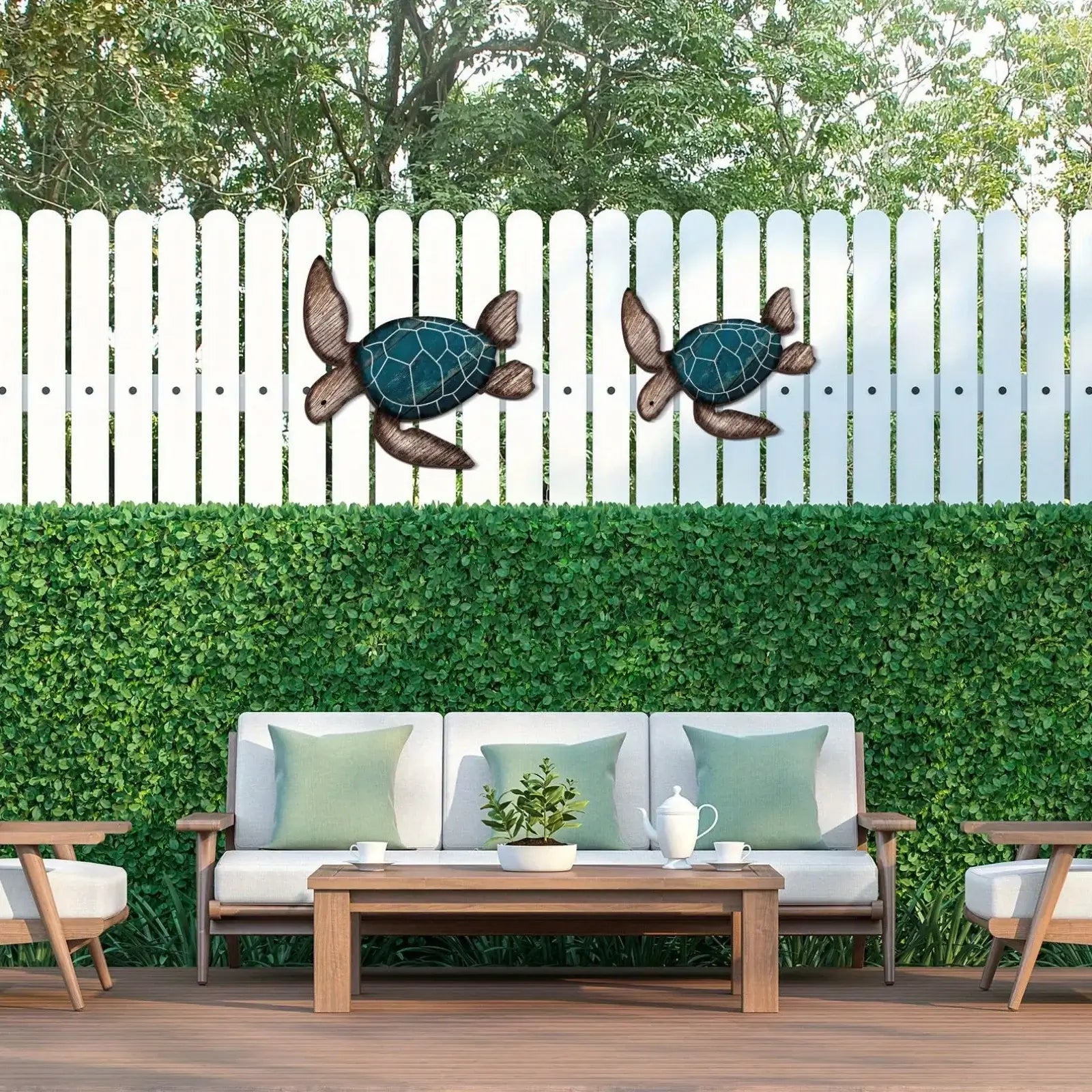 Wooden Turtle Wall Hanging Set - Coastal Decor | Handcrafted featured on a white outdoor fence, enhancing a garden patio with beachy charm.