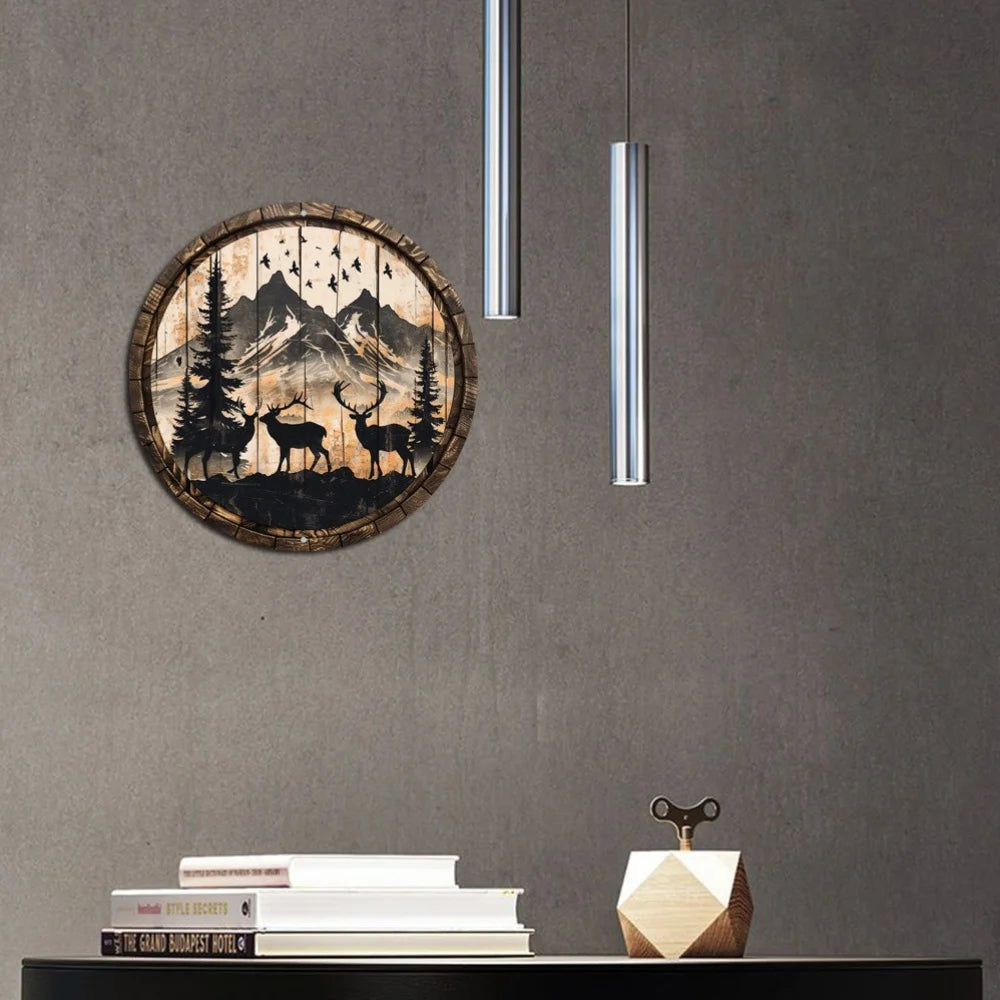 Rustic wildlife metal art sign with deer and mountain scene hanging on a gray wall. Perfect for indoor home decor.