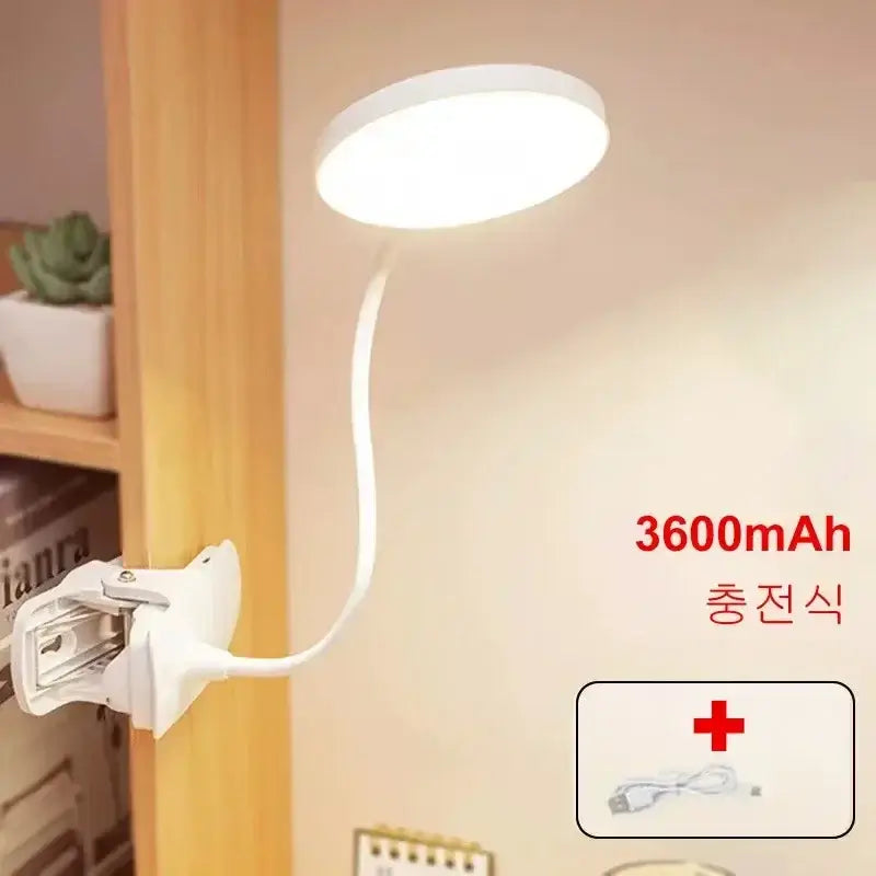 White clip-on LED desk lamp with 3600mAh rechargeable battery. Flexible neck for adjustable lighting in home or office.