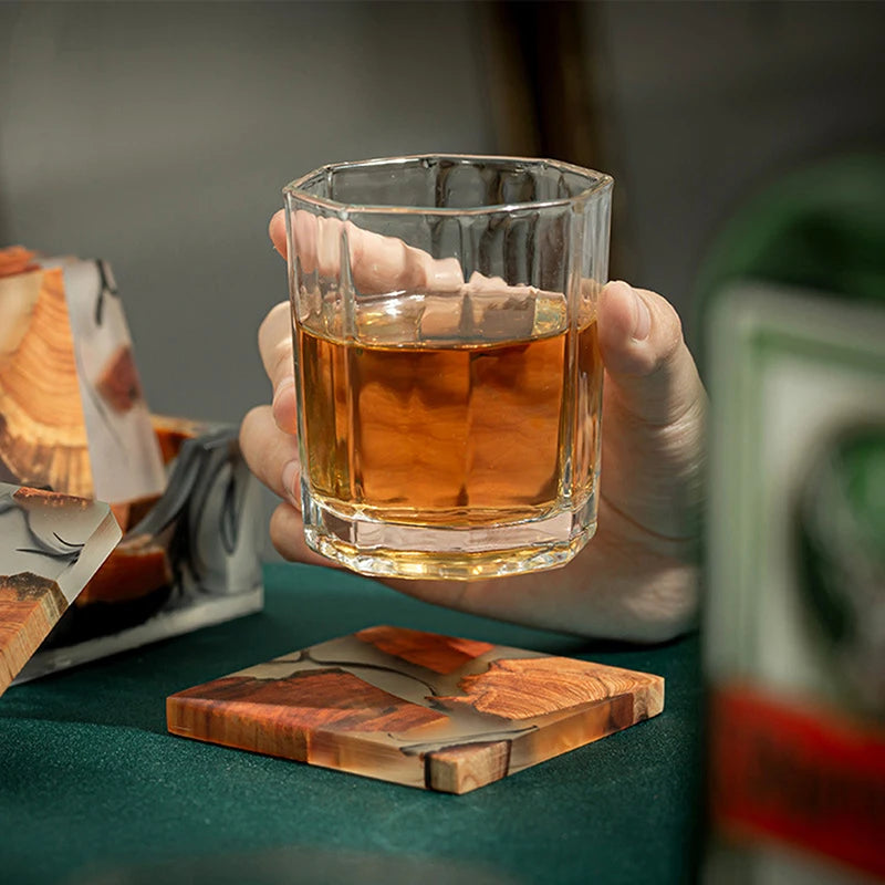 Glass of whiskey resting on Wooden Tea Coaster Resin - Insulation, emphasizing heat resistance and stylish square design.