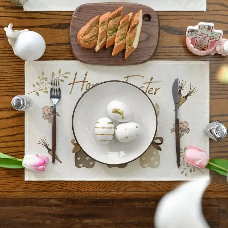 Easter Bunny Table Runner with matching placemats, featuring bunny silhouettes and gold-accented eggs. Enhances springtime dining decor.