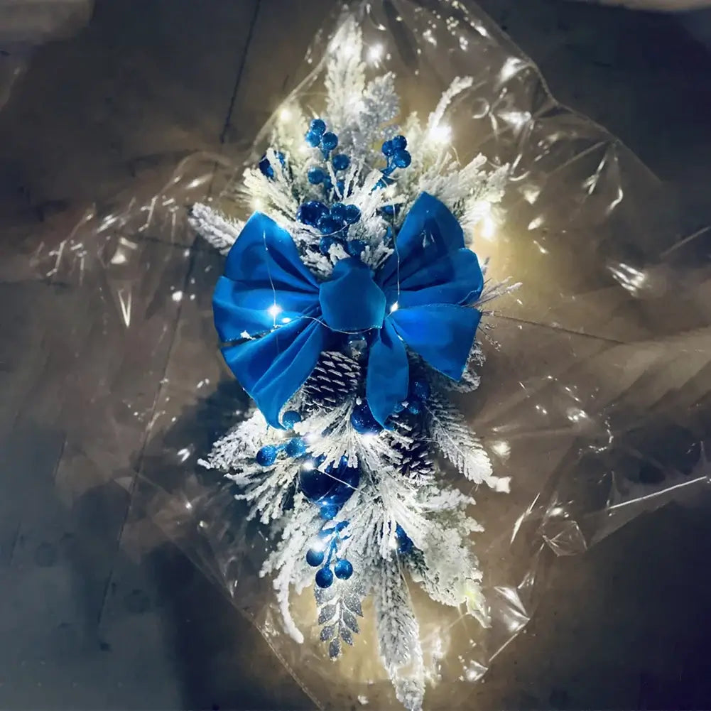 Blue and white Christmas Wreath Hanging Pendant with LED lights and pinecones, great for winter holiday home decor.