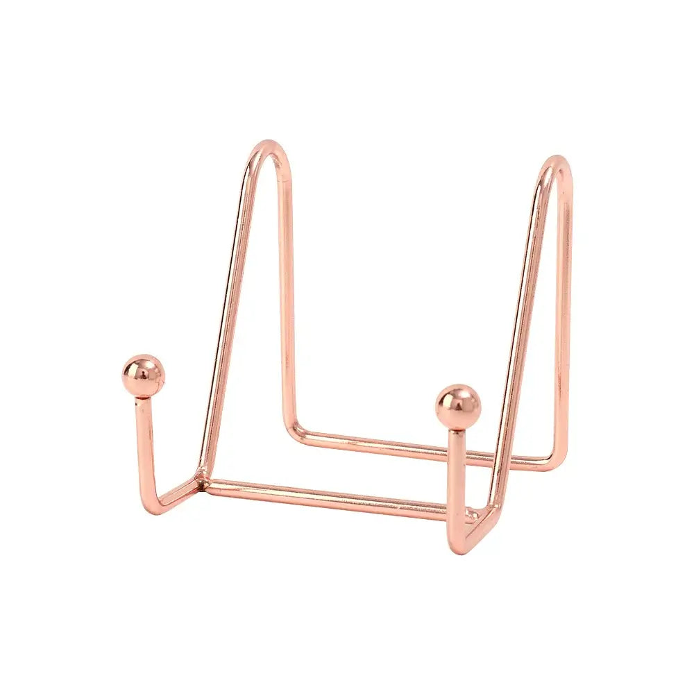 Small rose gold art display frame stand with elegant finish. Ideal for modern home decor and photo display.