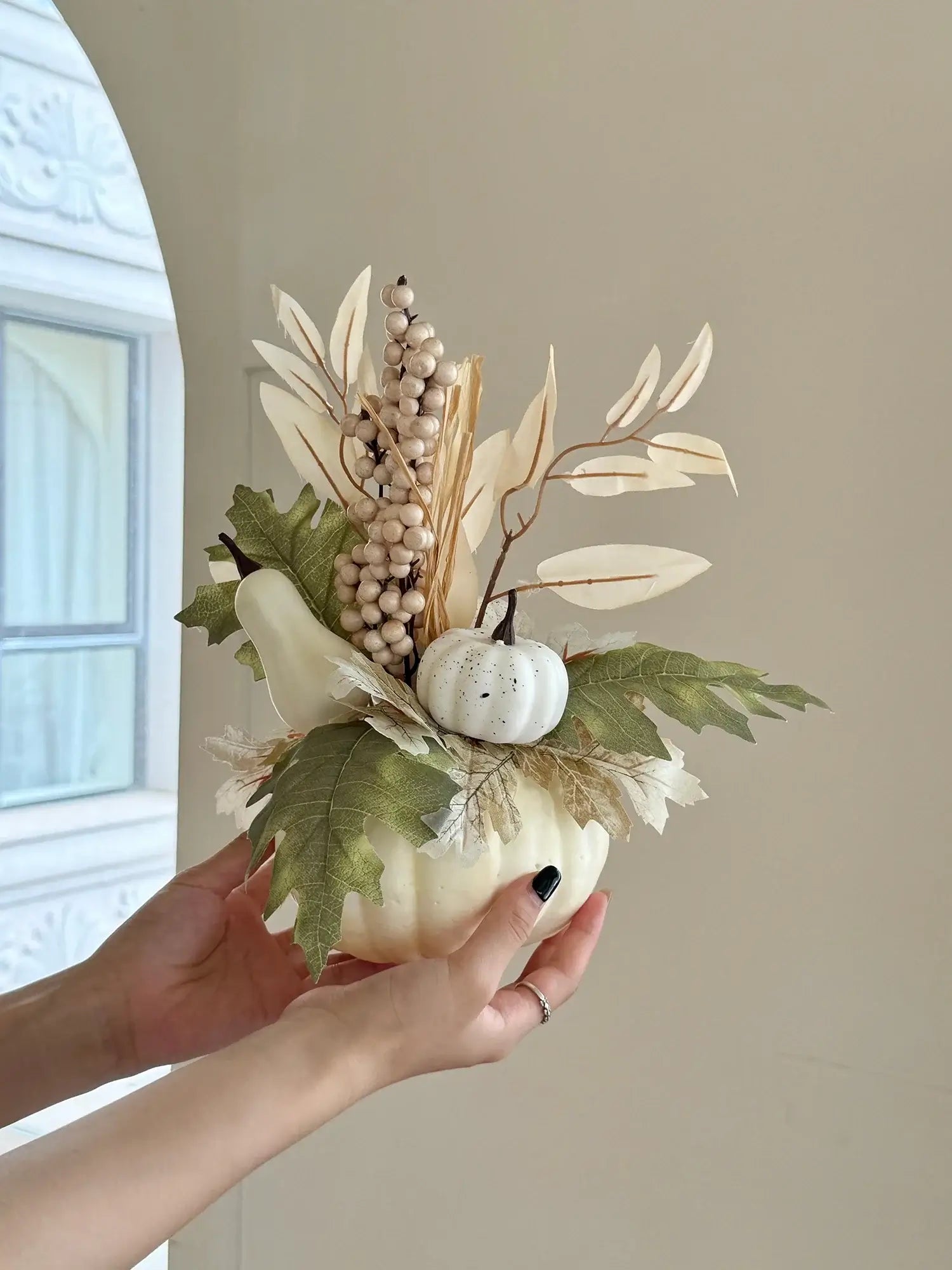 Handheld white Halloween Pumpkin Decor - Realistic 1pc polyester pumpkin with neutral-toned foliage and berries for elegant seasonal home decor.