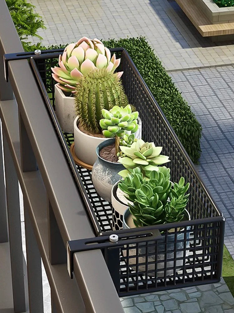 Balcony Plant Stand Windowsill with black metal mesh design holding potted succulents. Space-saving and ideal for outdoor railings.