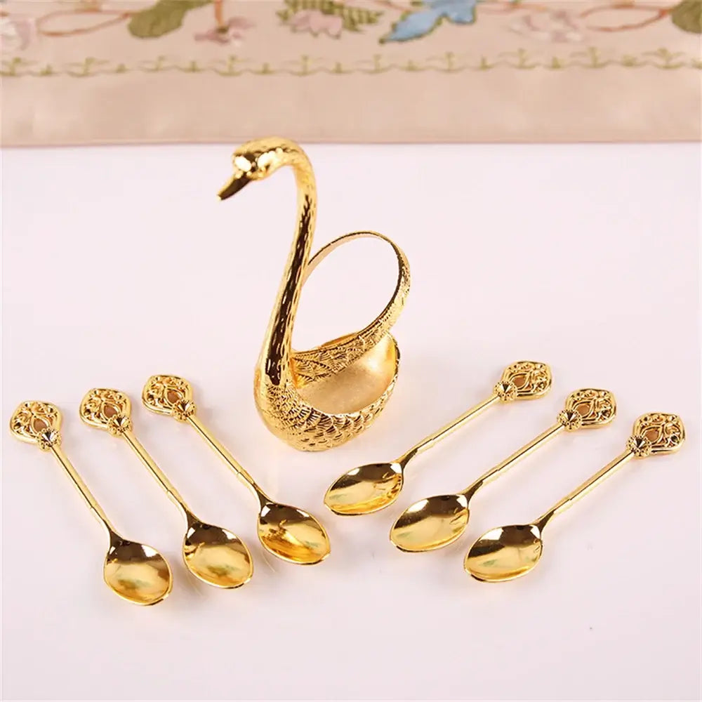 Gold Swan Spoon Holder Set with 6 matching spoons, perfect for mixing and serving in elegant dining settings.