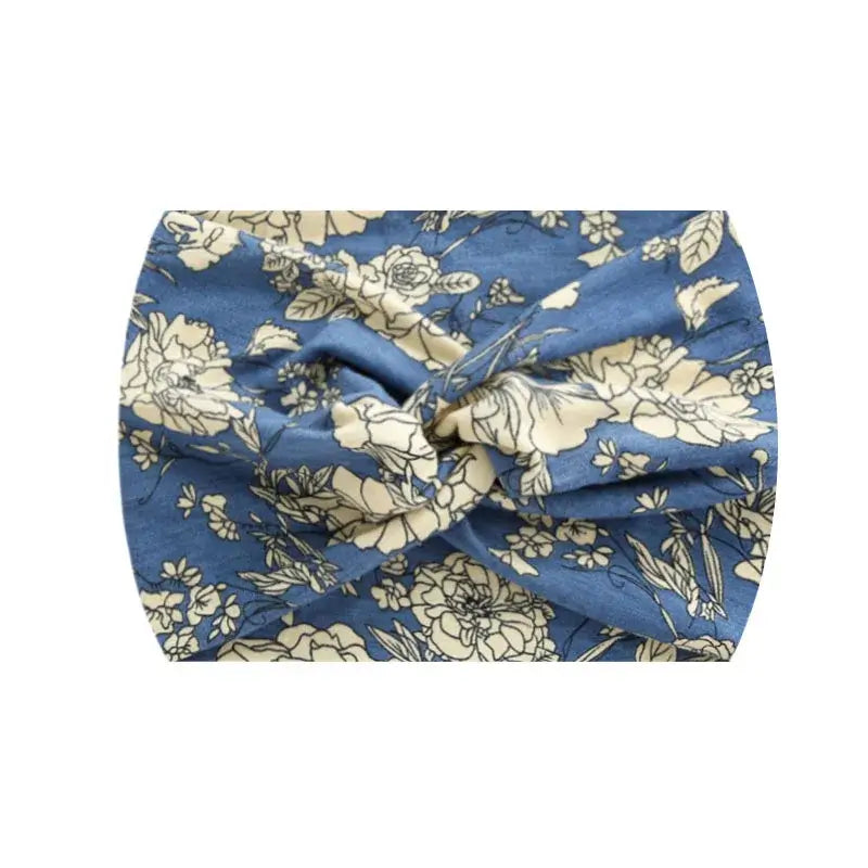 Blue floral 18CM stretch printed headband with cream blossoms. Soft and stretchy for sports or casual wear.