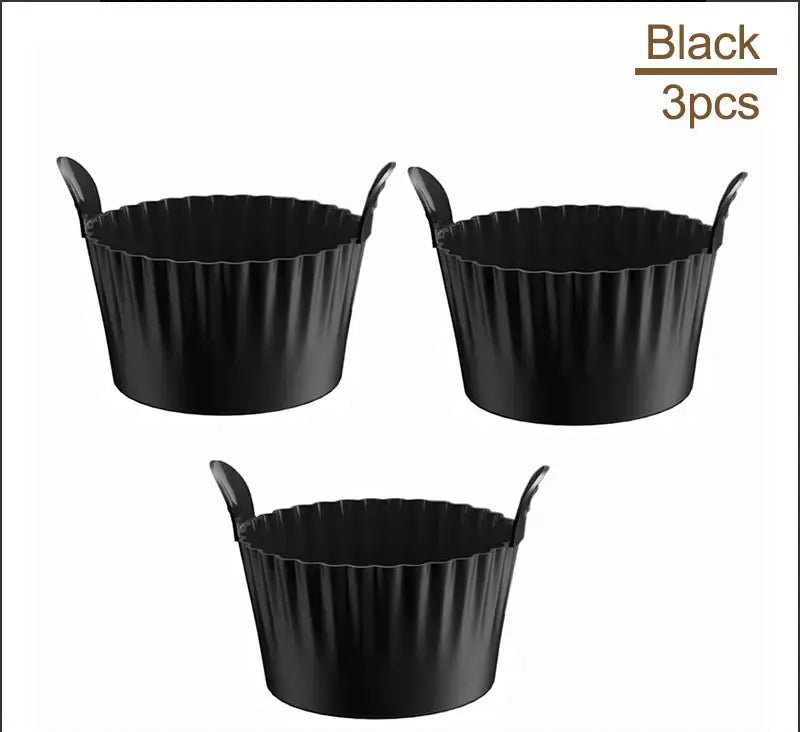 Set of 3 black Air Fryer Silicone Egg Cups for baking and boiling. Made from food-grade silicone with easy-grip handles.