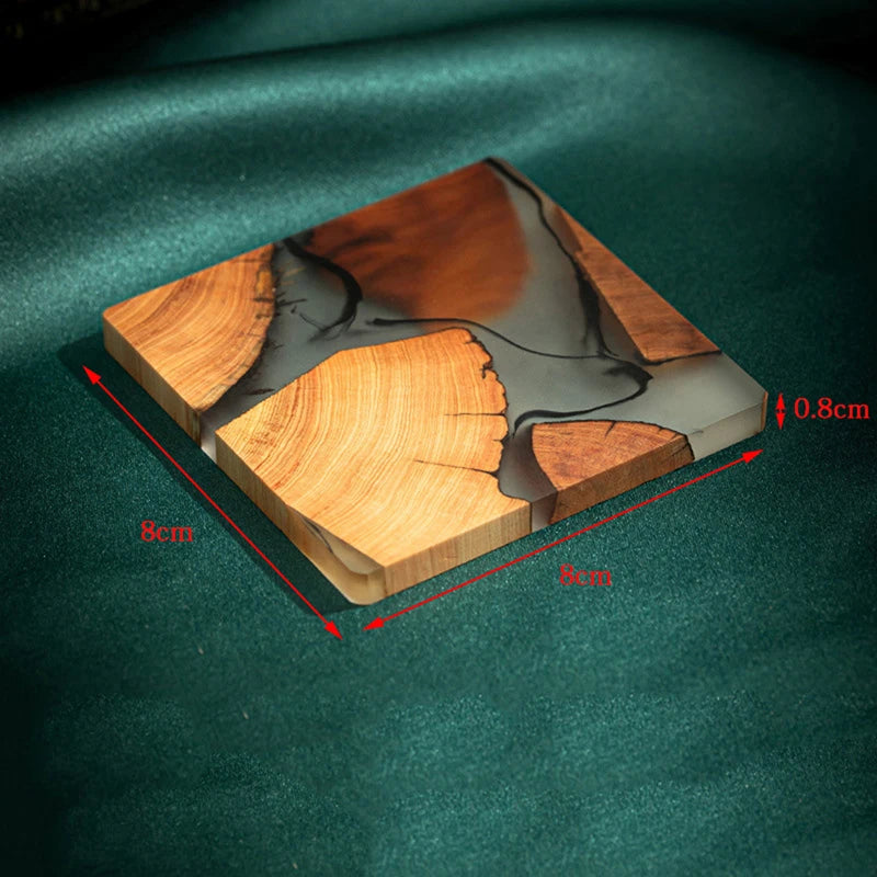 Wooden Tea Coaster Resin - Insulation with dimensions 8x8x0.8cm shown on green fabric, highlighting compact and durable build.