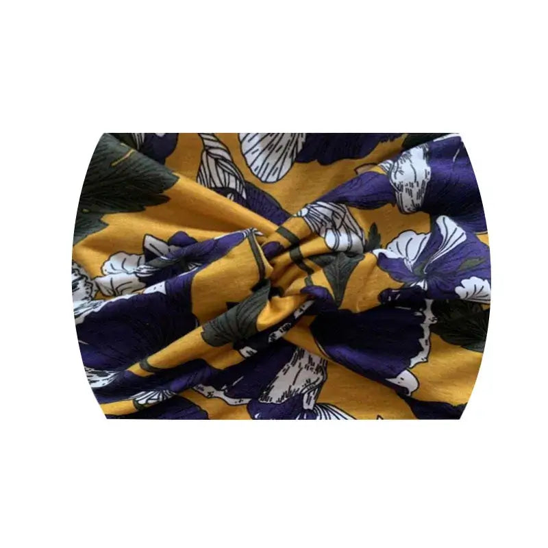 Yellow and purple floral 18CM stretch printed headband. Soft and breathable for athletic or casual use.