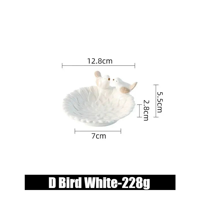 Small white ceramic flower jewelry tray with bird figurines, labeled D Bird White, ideal for rings and earrings.