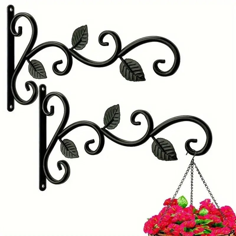 Set of two rustic wrought iron wall brackets with decorative leaf design, ideal for hanging plants or baskets indoors and outdoors.