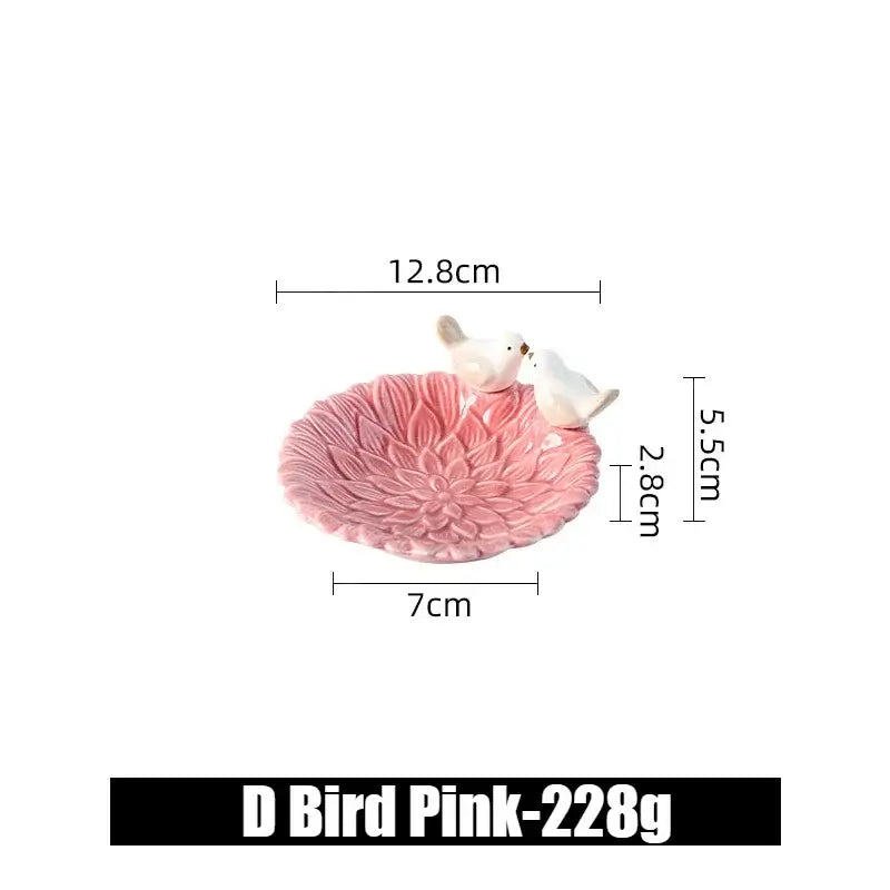Small pink ceramic flower jewelry tray with bird figurines, labeled D Bird Pink, perfect for delicate accessory storage.