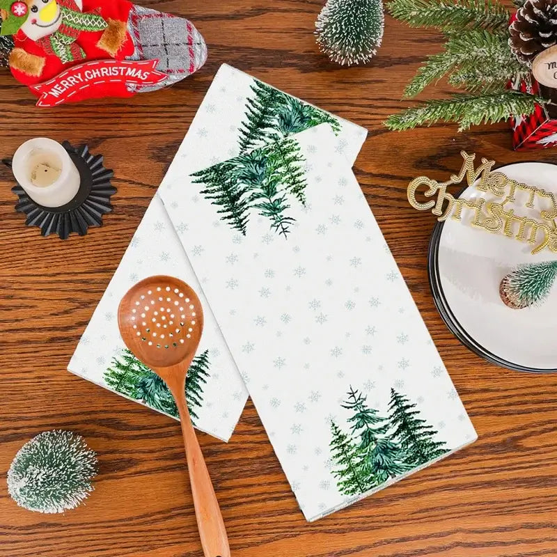 Red and black plaid Christmas kitchen towels with decorated tree print. Cotton towels add rustic charm to holiday kitchens.