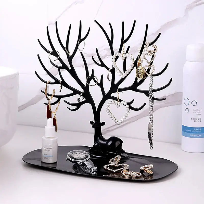 Black Tree Branch Jewelry Organizer on bathroom counter with necklaces, watches, and rings. Durable and elegant storage solution.