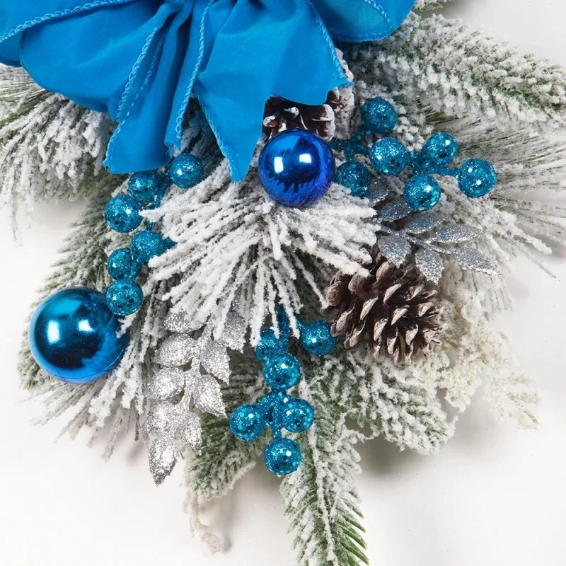 Blue Christmas Stair Wreath detail with snowy pine branches, ornaments, and glitter accents. Elegant holiday decor for stair railings.