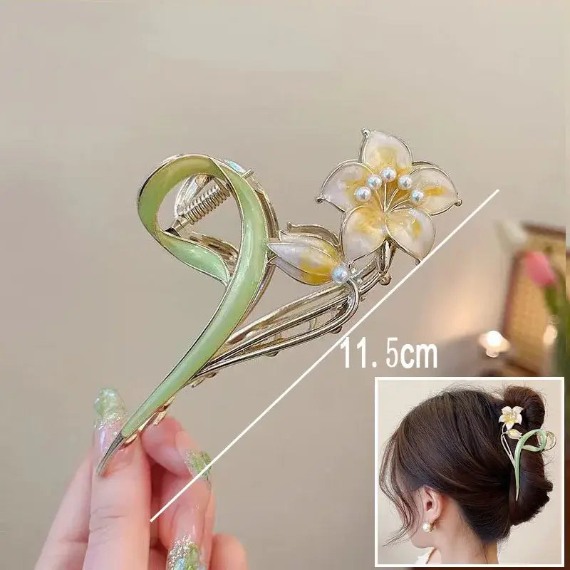 Yellow flower ponytail hair clip with pearl center and green swirl base, 11.5cm long, perfect for elegant updos.