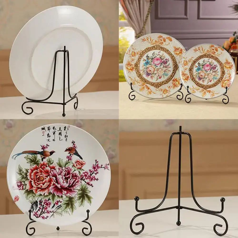 Black iron plate rack easel displaying decorative plates in various floral designs. Ideal for showcasing items in home or office decor.