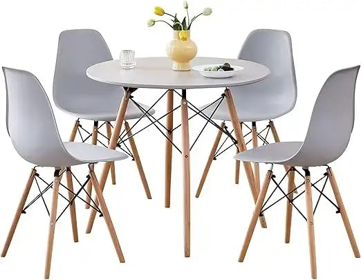 Gray 5-piece round dining table set with matching chairs and wooden legs, designed for compact kitchens and dining rooms.