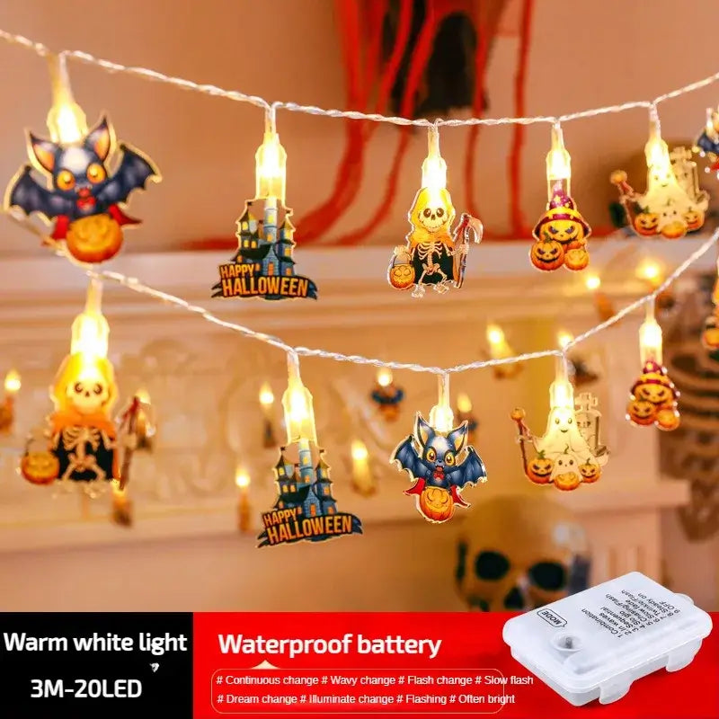 Warm white LED Halloween string lights with bats, skeletons, and pumpkins. Waterproof battery for outdoor use.