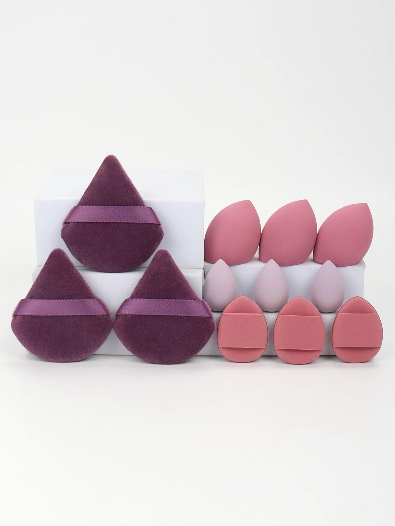 Plum and mauve 12-piece makeup sponge set with velvet puffs and sponges. Ideal for precise makeup blending and smooth coverage.