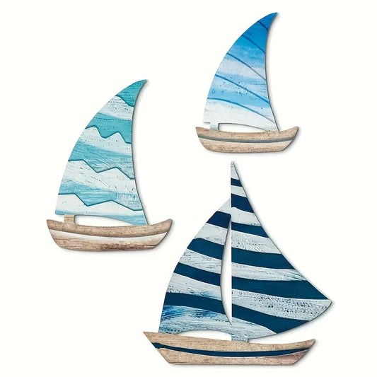 Wooden Sailboat Wall Art Set featuring 3PCS of nautical-themed sailboats in blue tones. Ideal for coastal home decor and beach house accents.