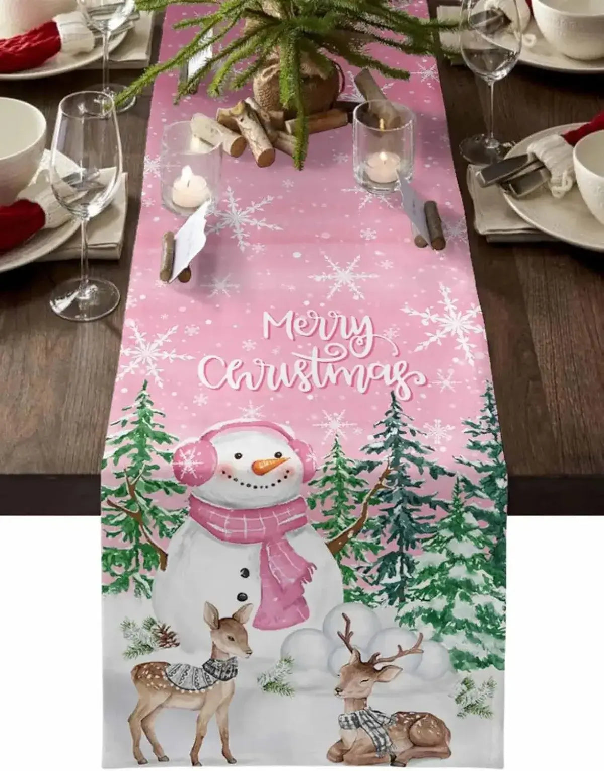 Pink Christmas linen table runner with snowman and reindeer in snowy forest. Festive holiday decor for cheerful dining table settings.
