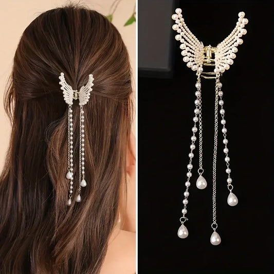 Women Butterfly Tassel Hair Clip in pearl design worn on half-up hairstyle. Elegant butterfly shape with dangling tassels for a graceful look.