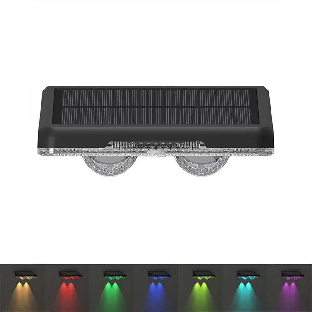 Close-up of LED Solar Fence Lights Outdoor with RGB color options including red, green, blue, yellow, cyan, and purple for vibrant lighting.