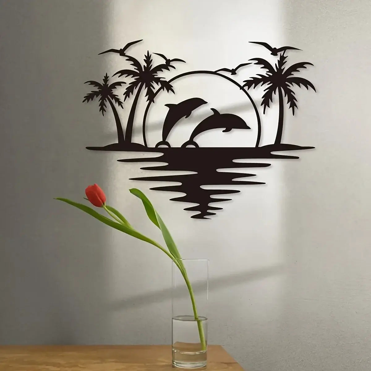 Dolphin Coconut Tree Hook - Indoor Outdoor Decor featuring iron dolphin and palm tree silhouette on a neutral wall, ideal for coastal-themed interiors.