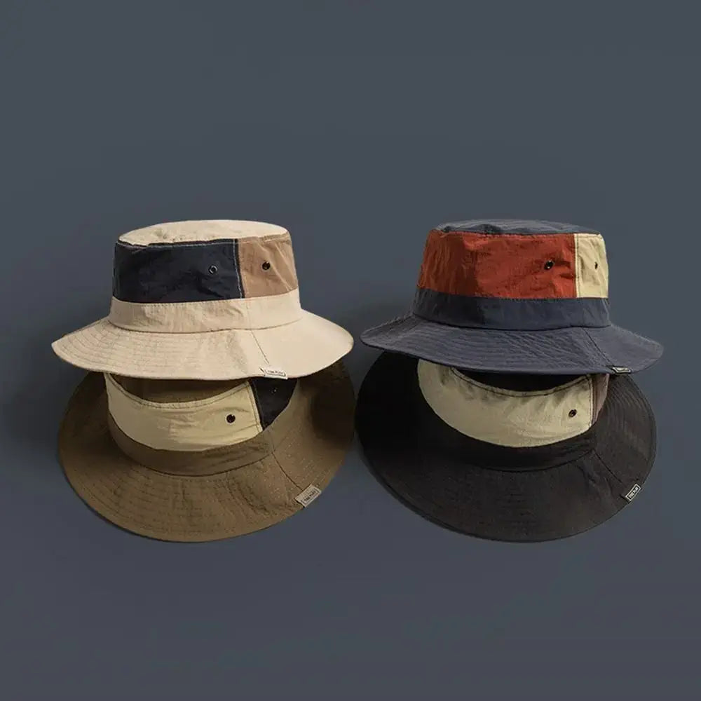 Top view of two Sun Protection Bucket Hats - Quick-dry with wide brims and color-block panels. Ideal for sun protection and travel.