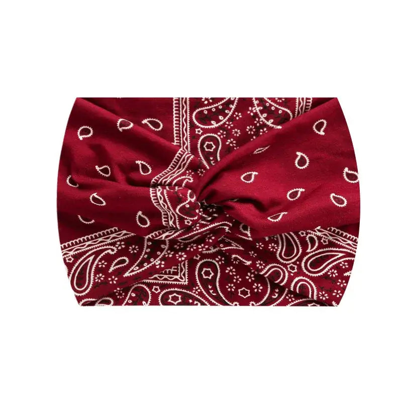 Red paisley 18CM stretch printed headband with white detailing. Ideal for workouts or casual styling.