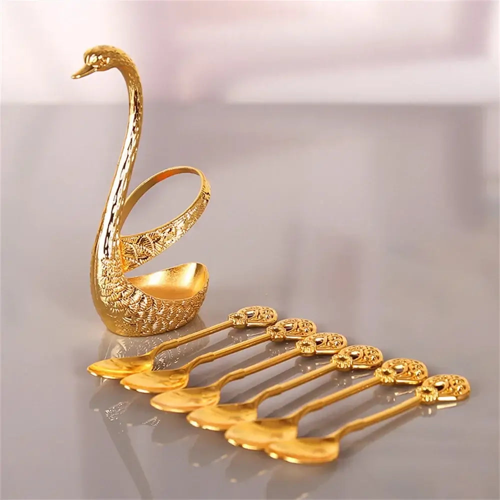 Gold Swan Spoon Holder with 6 intricately designed spoons, perfect for serving desserts, coffee, or fruit elegantly.