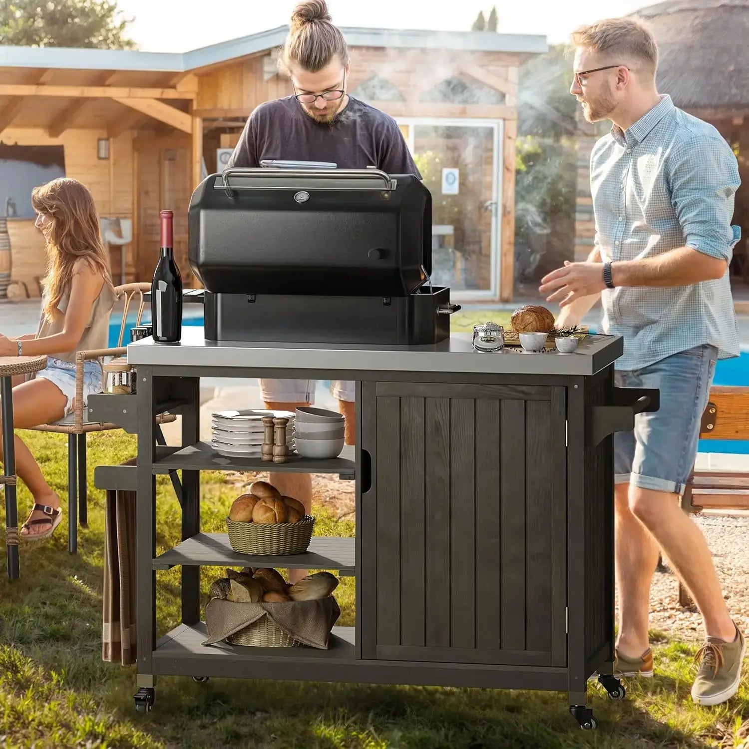 XL Wood Outdoor Grill Cart in use during backyard BBQ, showcasing spacious storage, grill setup, and lockable wheels.