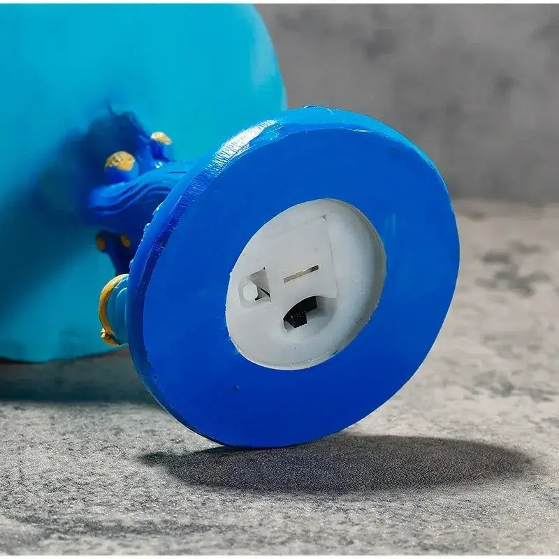 Close-up of the power plug socket on the base of a Stained Plant Series table lamp. AC powered for easy indoor use.