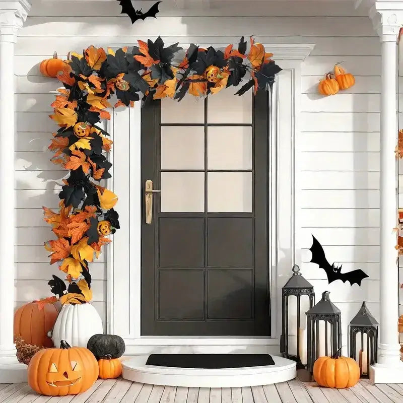 Halloween Garland with maple leaves and pumpkins frames a door. Ideal for outdoor fall decor with bats and lanterns for a festive look.