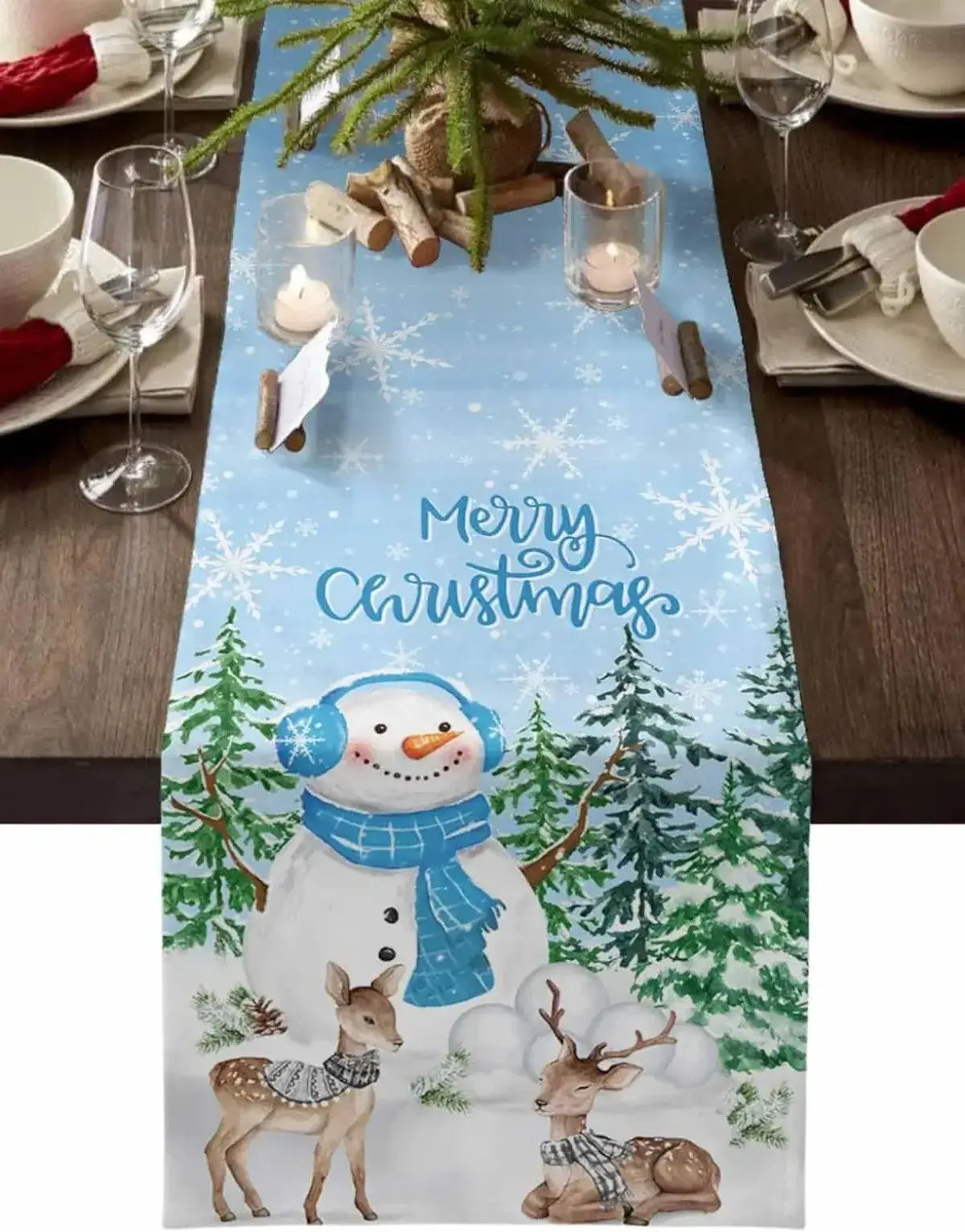 Christmas table runner in blue with snowman and reindeer design. Linen fabric adds festive charm to holiday dining and seasonal decor.