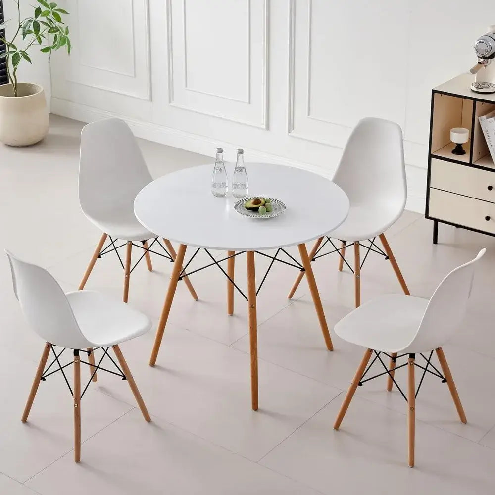 5-piece round dining table set with white tabletop and four white chairs, space-saving design ideal for modern kitchens or dining rooms.