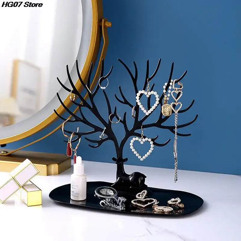 Jewelry Tree Storage Rack displayed on vanity with necklaces, rings, and earrings. Elegant tree branch design for organized storage.